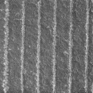 Grooved natural stone surface finish example in grayscale