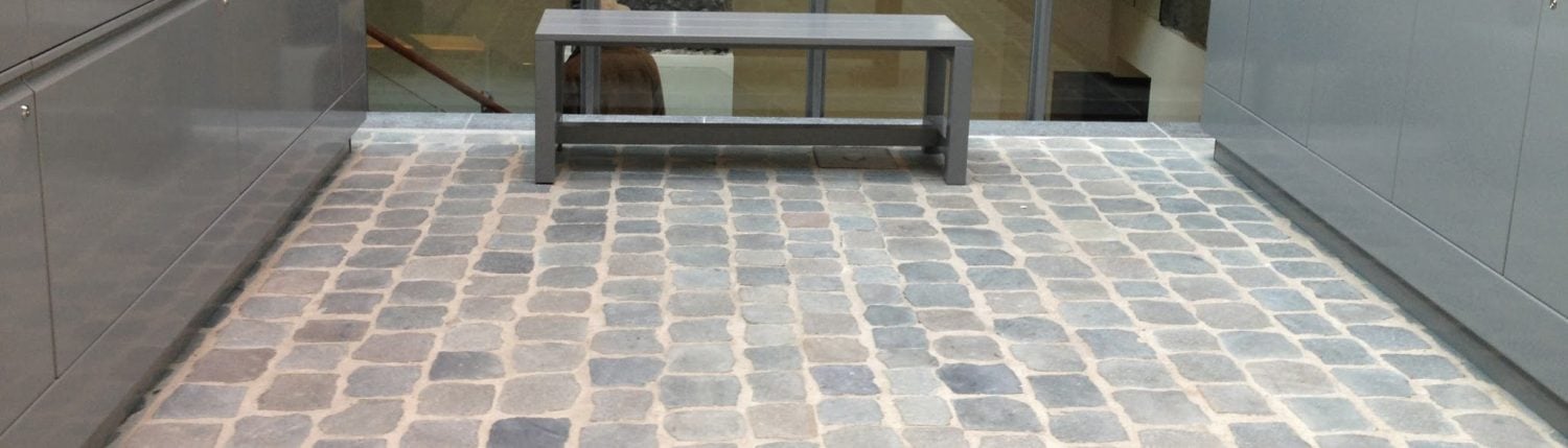 Reclaimed porphyry flat cobblestone interior floor